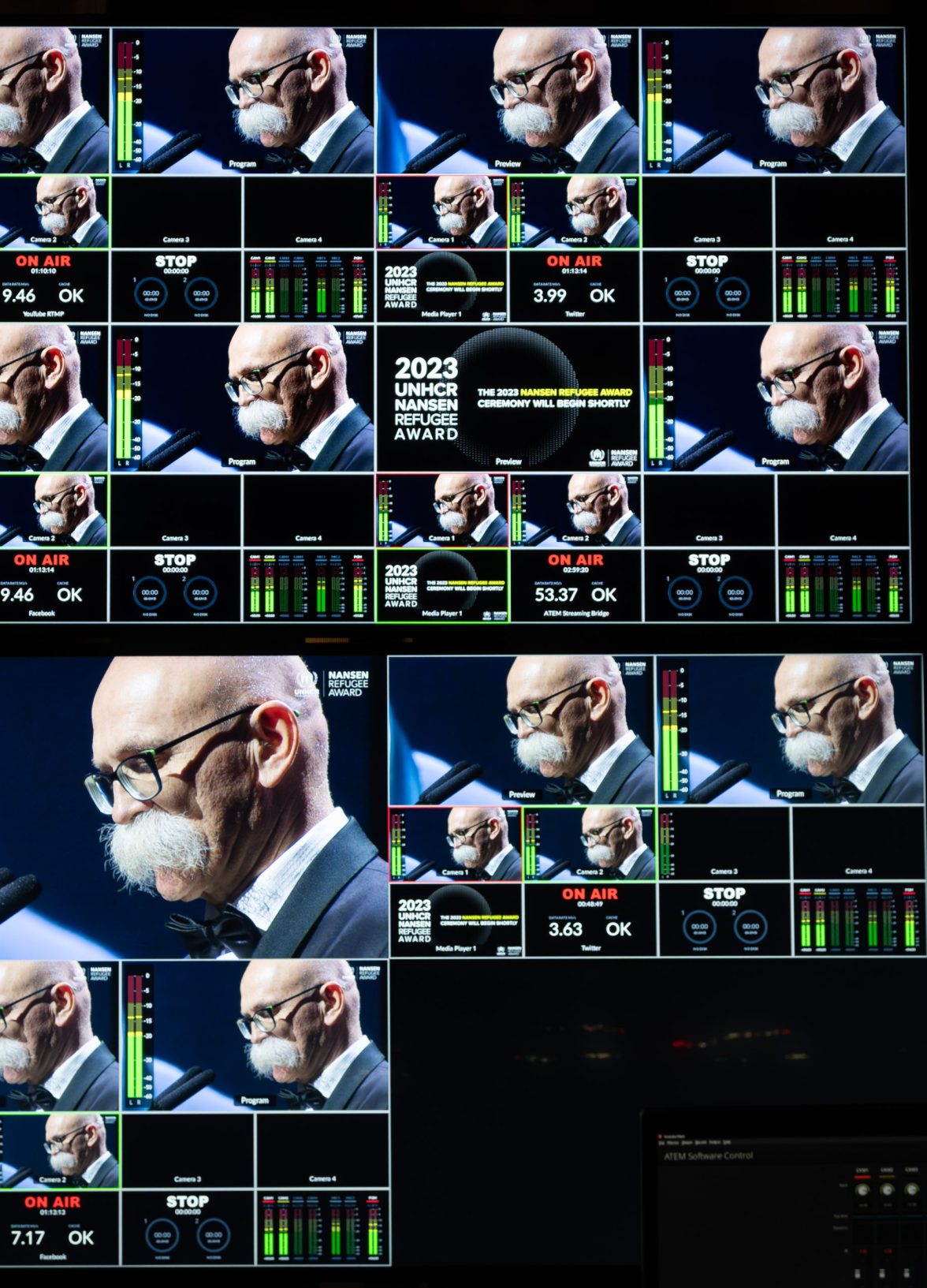 Live broadcast control room screens showing multiple camera feeds of a speaker during the Nansen Refugee Award – Hybrid Ceremony, with on-air indicators and technical monitoring displays.