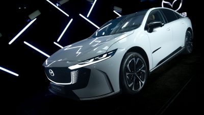 Mazda 6E displayed in a cinematic lighting environment with geometric light elements during the Mazda – Cinematic reveal of the Mazda 6E.