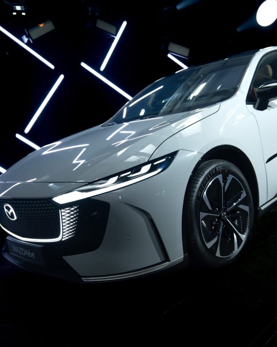 Mazda 6E displayed in a cinematic lighting environment with geometric light elements during the Mazda – Cinematic reveal of the Mazda 6E.